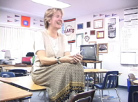 teacher sitting and smiling